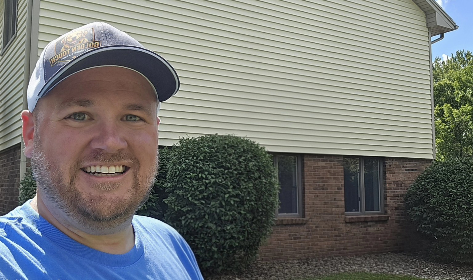Nick Maneely, owner of Golden Touch Exterior Cleaning, at a residential exterior cleaning project