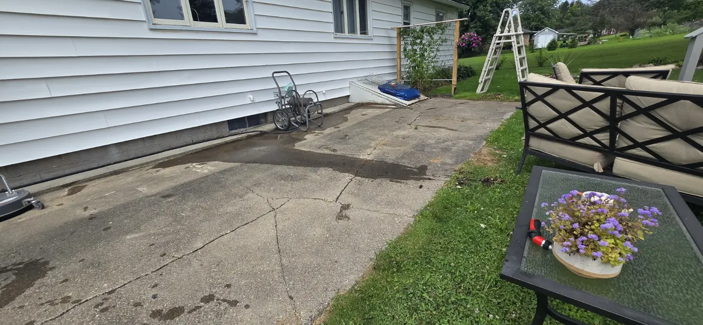 Weathered side patio before cleaning