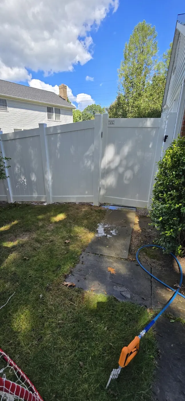 Coated privacy fence after careful low-pressure cleaning in Pittsford